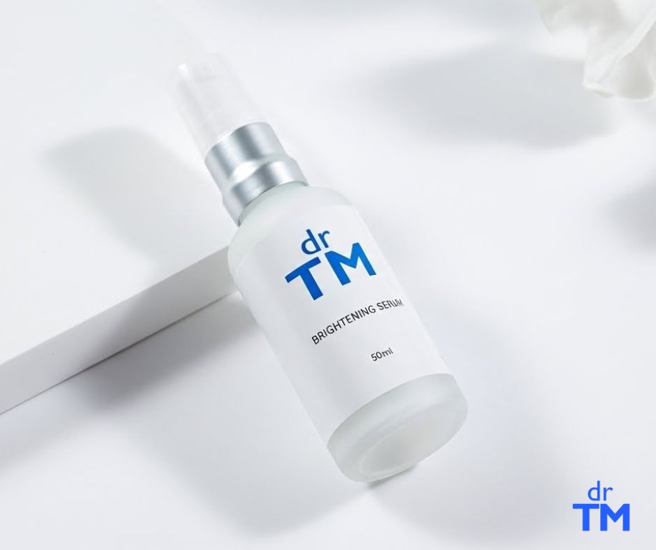 DR TM Brightening Serum bottle, cream label